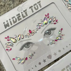 New in package adhesive face jewels for parties , costume , etc . Six designs.